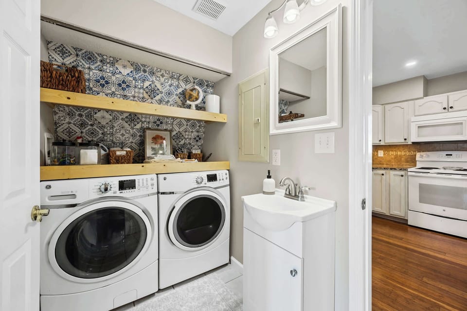 Half Bathroom 1: Fresh and functional! This convenient half bath is stocked with essentials, including a washer and dryer, making your stay even more comfortable.