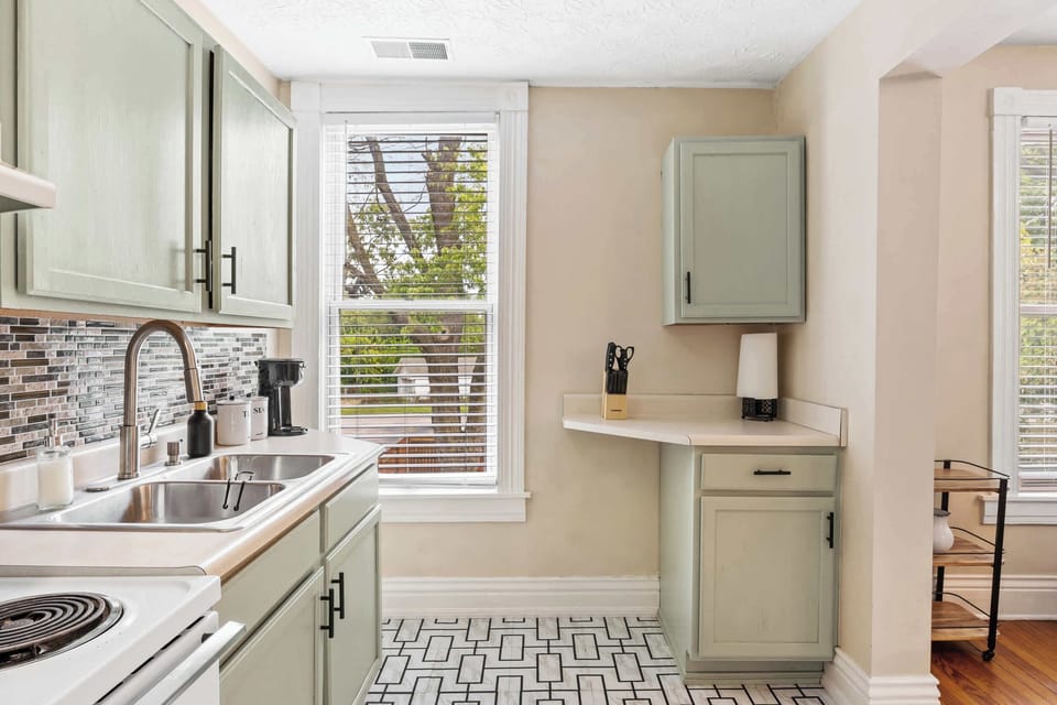 Kitchen: Bright, clean, and full of character! This kitchen offers a welcoming space for all your culinary adventures.