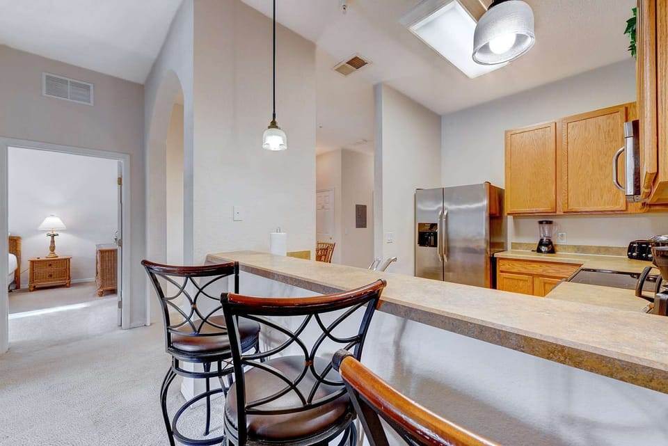 Modern kitchen with a breakfast bar and stainless steel appliances