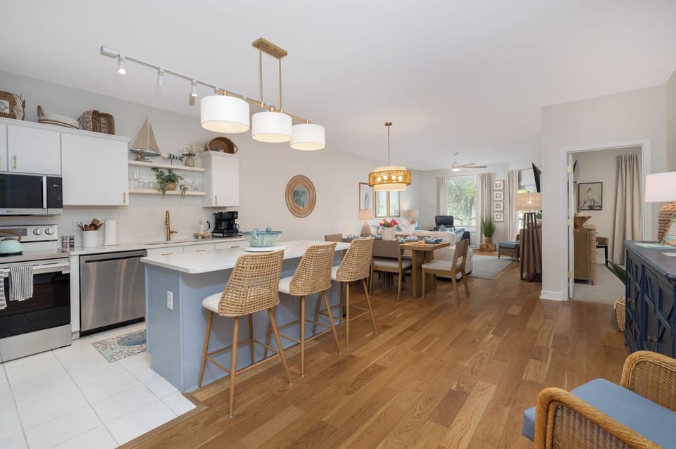 Step into your beautifully designed open-concept space where modern coastal style meets comfort, perfect for cooking and gathering