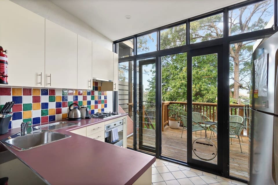 From the kitchen, step out to your private deck and enjoy morning coffee or evening drinks with tranquil treetop views.