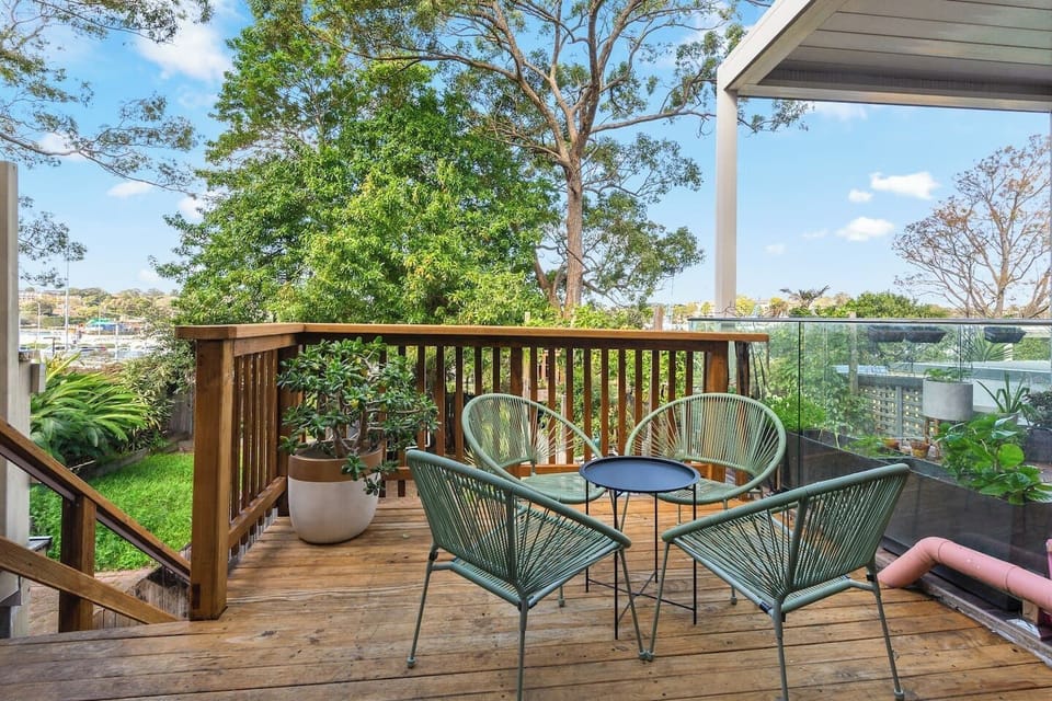 Enjoy alfresco breakfasts or a quiet morning coffee on the freshly stained deck, surrounded by greenery and warm natural light.