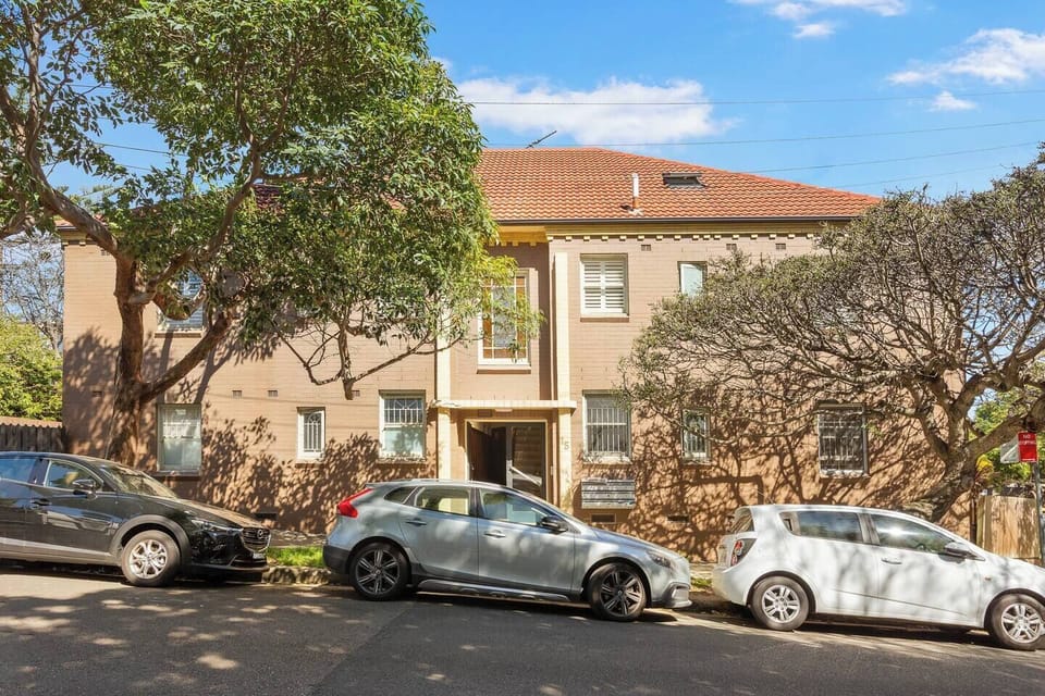 This classic brick building sits on a peaceful street, just a five-minute troll from the gates of Centennial Park.