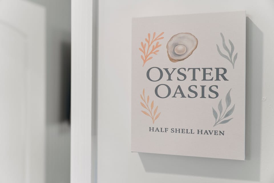 Oyster Oasis with king bed, cozy seating, and smart TV for a relaxing retreat.