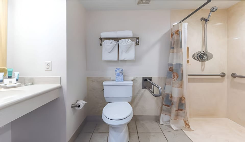 Refresh easily with accessible walk-in shower and clean finishes.