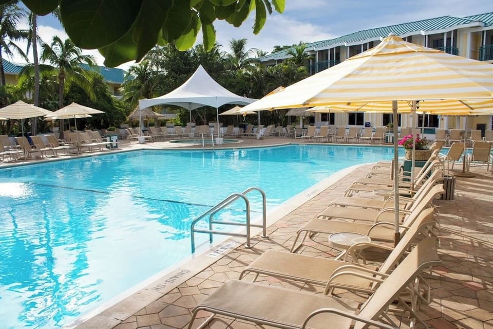 Lounge all day under umbrellas with easy poolside access.