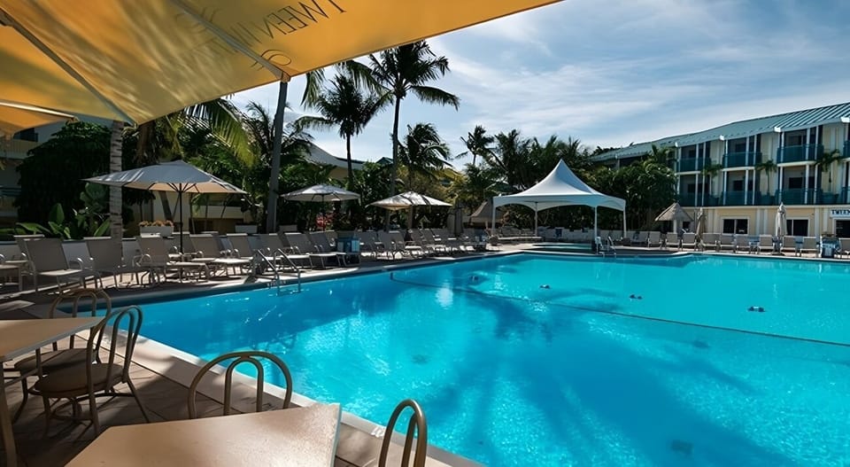 Cool off in the serene pool as afternoon shadows drift.