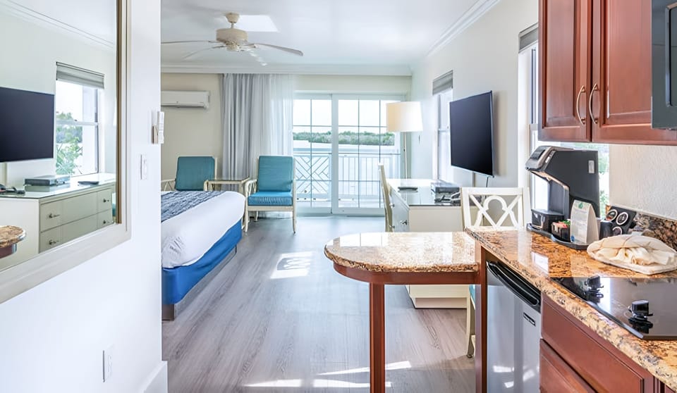 Ease into vacation with kitchenette comforts and bright bay views.