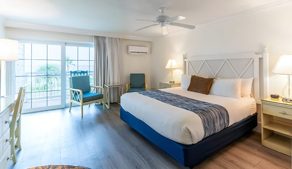 Sink into crisp linens and wake to soothing coastal light.