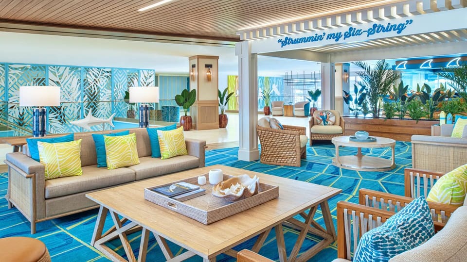 Settle into cozy conversation corners with bright coastal design touches.