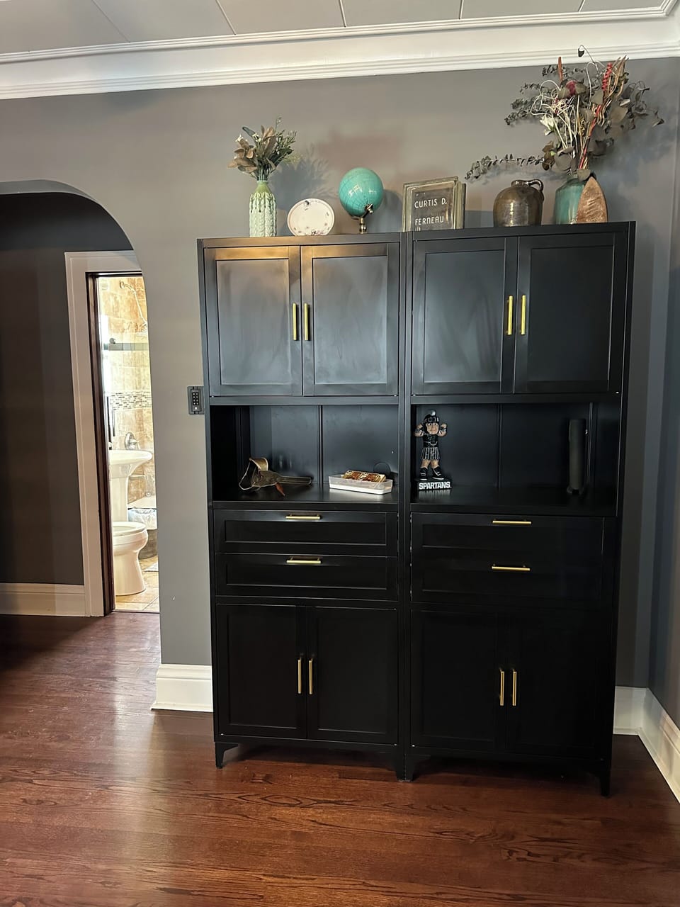 Dining room cabinet leading to bedroom/bathroom