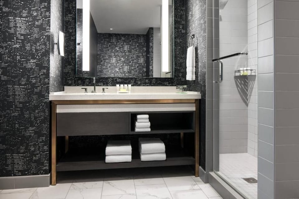 Get ready comfortably with bright mirror lighting and fresh towels.