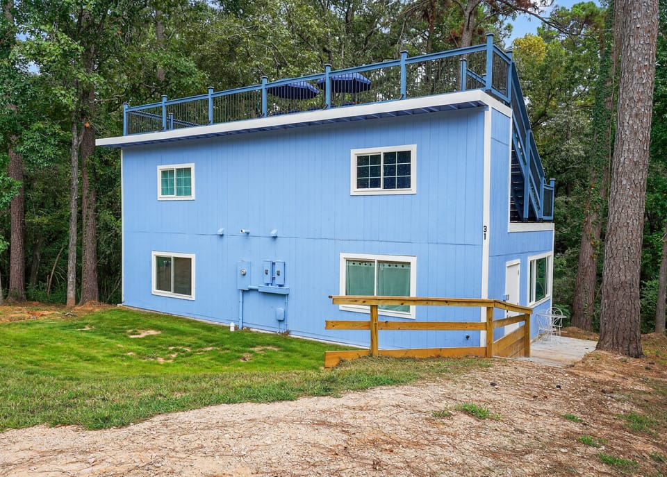 Evergreen Estates Castle has a driveway for 8+ cars and sits on over an acre of old-growth forest