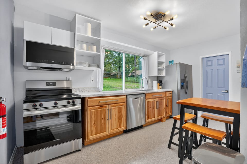 Kitchen features ice+water dispensers on the fridge and all-new 2025 appliances