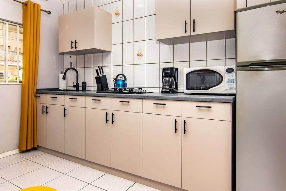 Kitchen with basic cooking utensils and equipment 