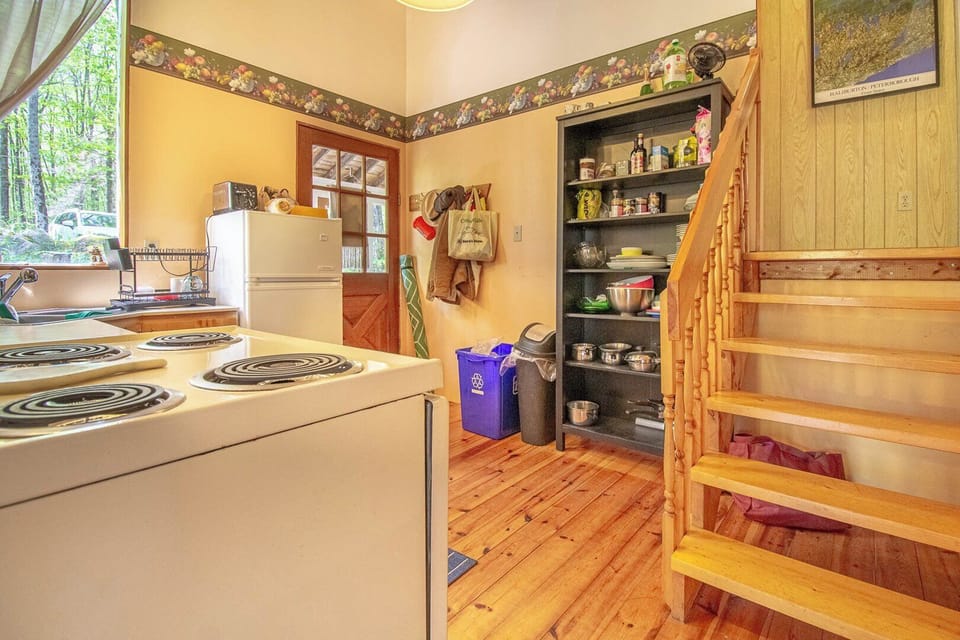 Front Entrance into Kitchen with Stairs to Upper Level