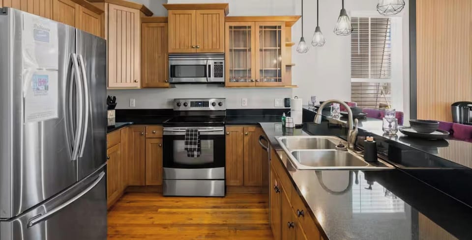 A full kitchen built for group getaways — plenty of counter space, storage, and style.