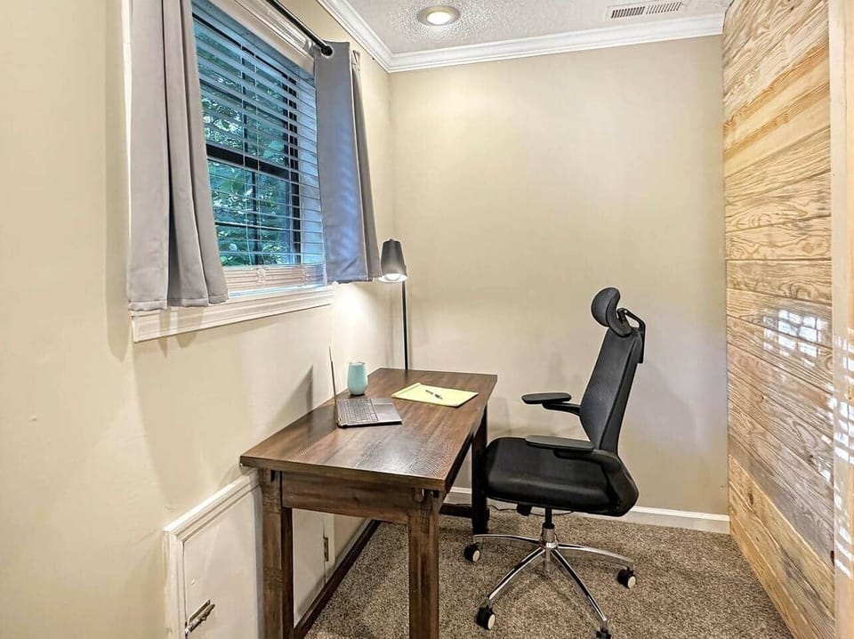 Need to jump on a quick conference call, enjoy this private office space with outside view of the woods