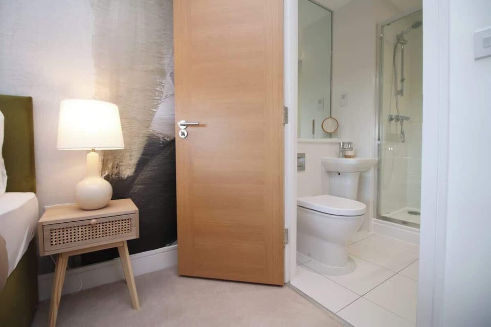 Conveniently located near the private bathroom, this bedroom combines comfort, practicality, and modern style for a seamless stay.