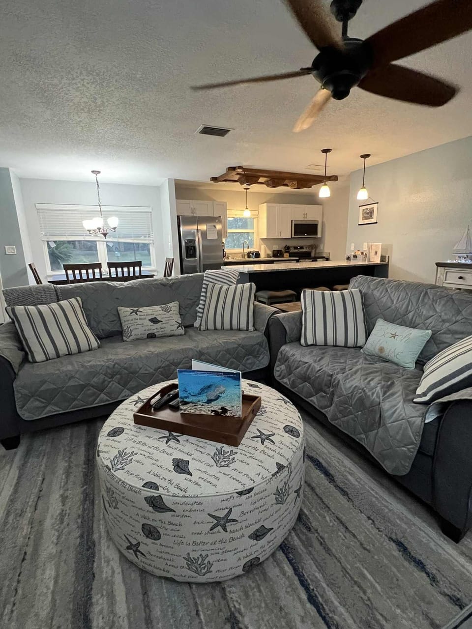 Living Room featuring a couch, love seat and ottoman. 