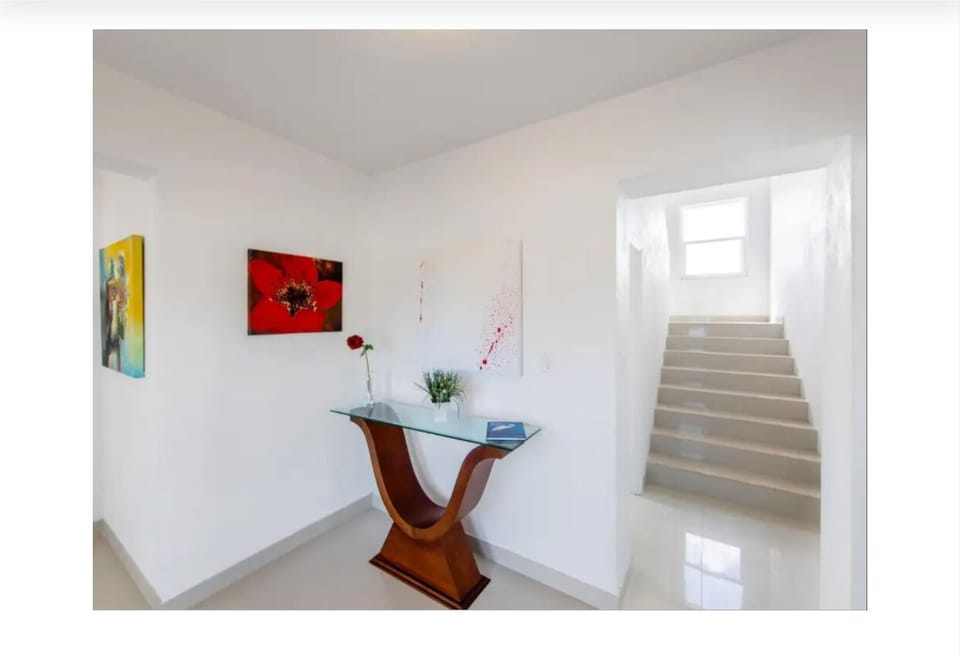 Hallway leading to upper deck and upper master bedroom/bath.