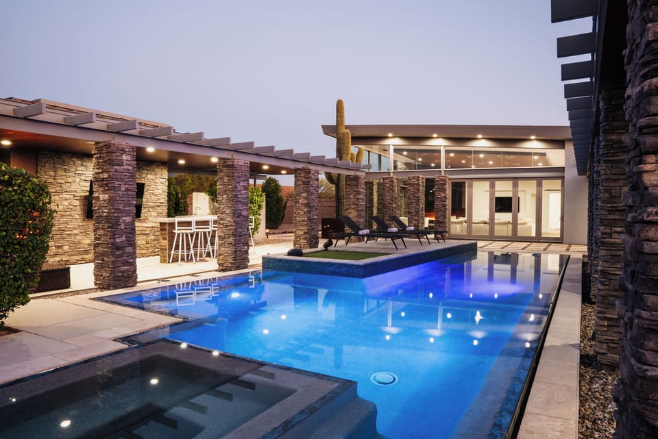 Indulge in resort-style living—sparkling waters and sleek design elevate every moment.