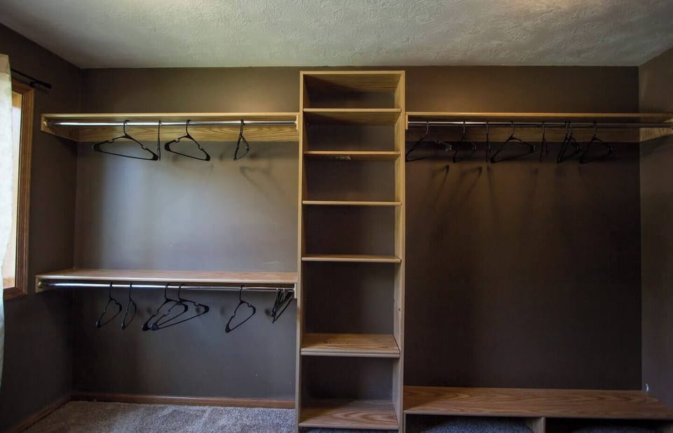Closet with storage shelves.