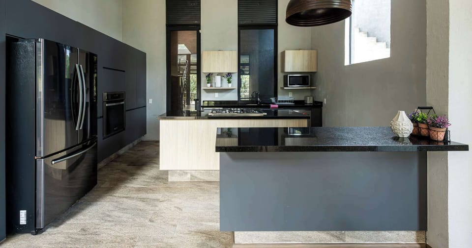 Fully equipped kitchen with full fridge, oven, microwave, stove, and dishwasher