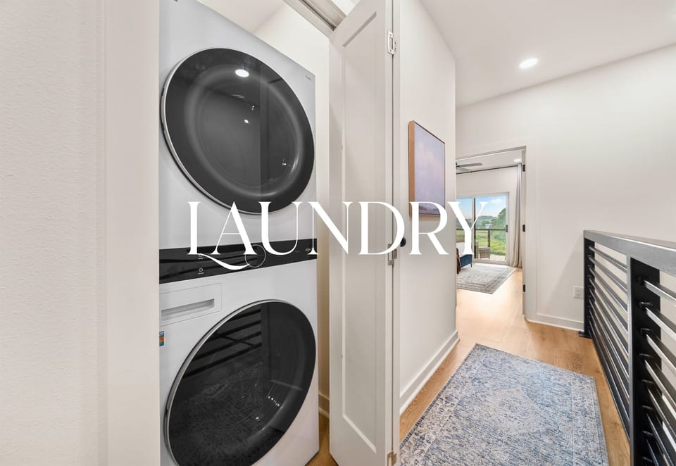 Laundry room with washer and dryer for guest convenience.