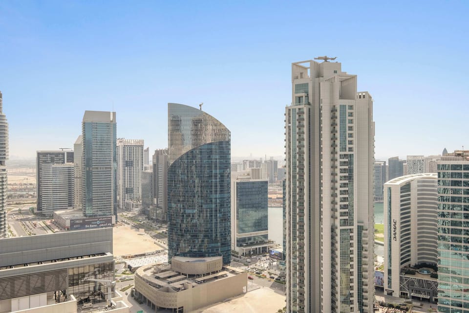 Balcony view framing towering cityscapes