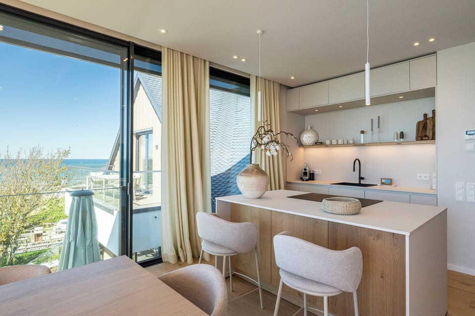 Modern Kitchen with Dining Table and Large Windows