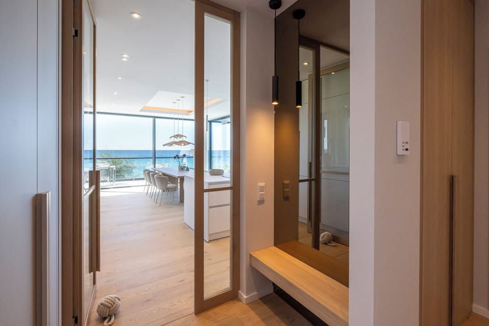 Entrance Area with Wooden Bench and View of Living Space
