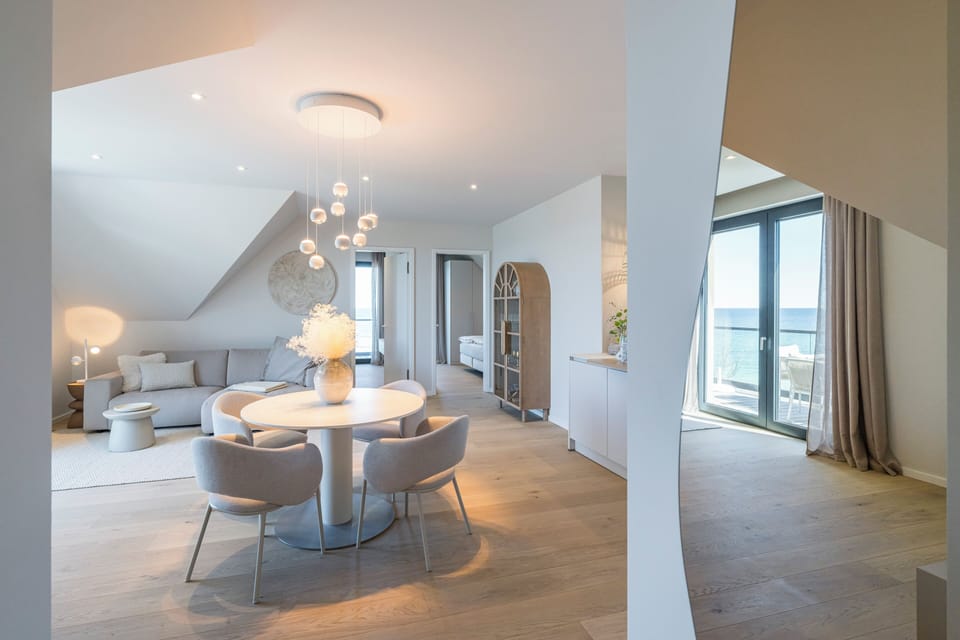 Cozy Living Room with Dining Table and Sea View