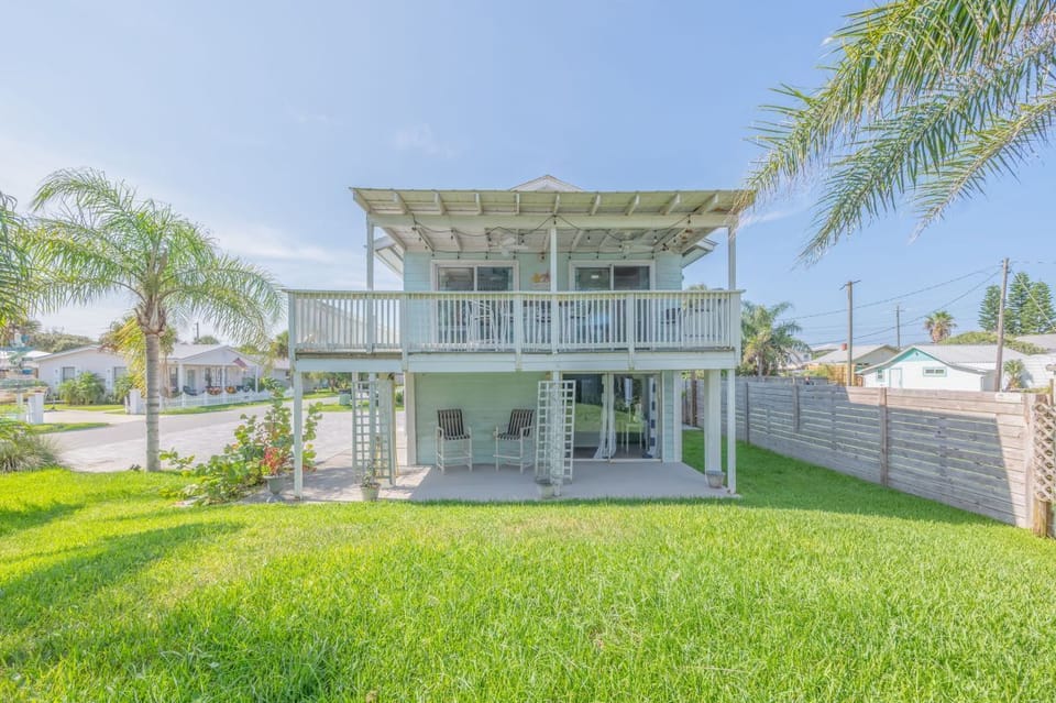 Spacious coastal home with two levels of outdoor living and plenty of room to enjoy the Florida sunshine