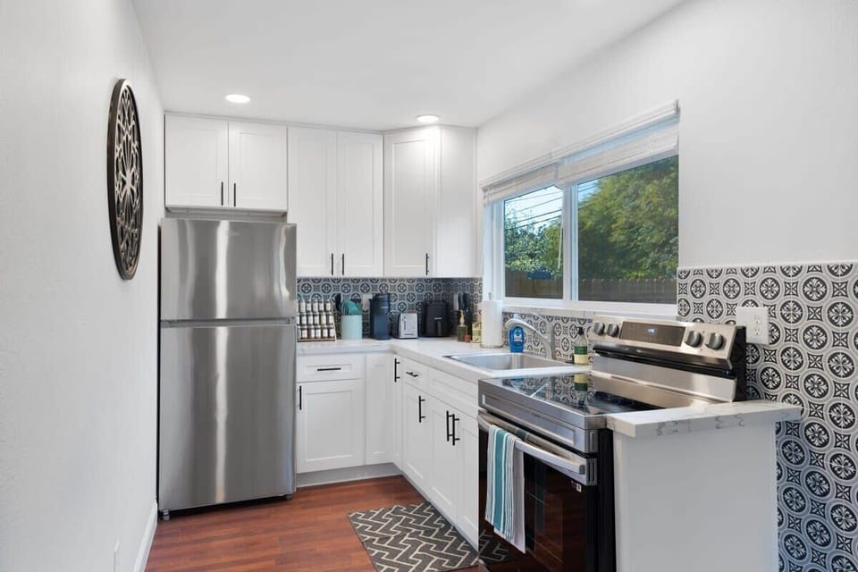 Stainless steel appliances in the fully stocked kitchen