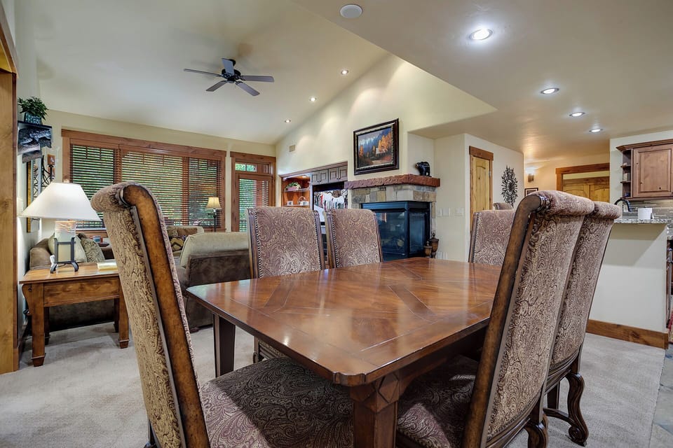 Gather around this elegant dining table for memorable meals with your group in this spacious open-concept living area.