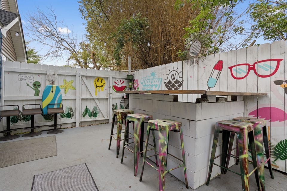 Private Patio with Bar leads to Back Yard. 
