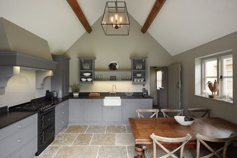 The open plan kitchen has all of the high quality features needed to ensure enjoyable cooking and ample storage. Guests can enjoy eating meals in the kitchen with a lovely view out onto the garden. 