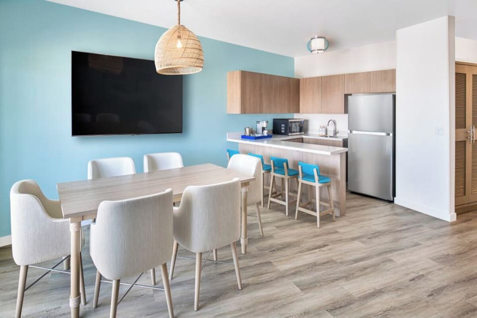 Gather for meals in a bright kitchen with breakfast bar.
