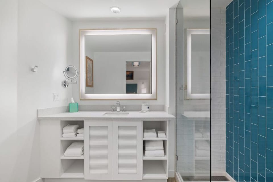 Refresh at a bright vanity with plush towels within reach.