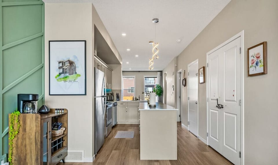 Fully equipped kitchen with island seating and stainless steel appliances