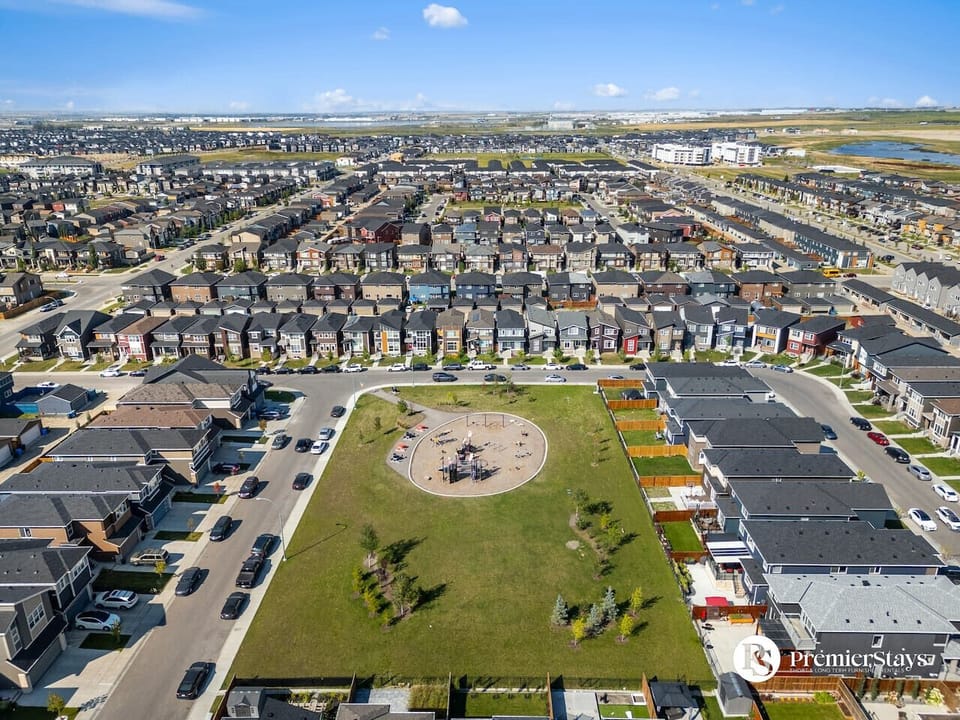 Central playground and green space surrounded by modern residential homes