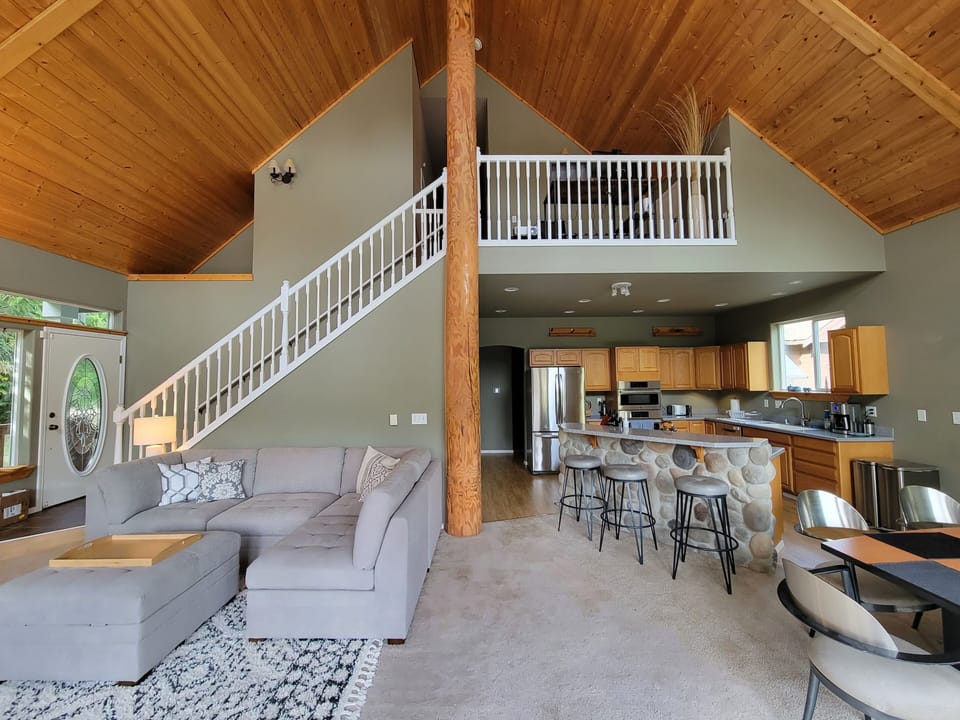 Gorgeous open floorplan with wood ceilings and central pole