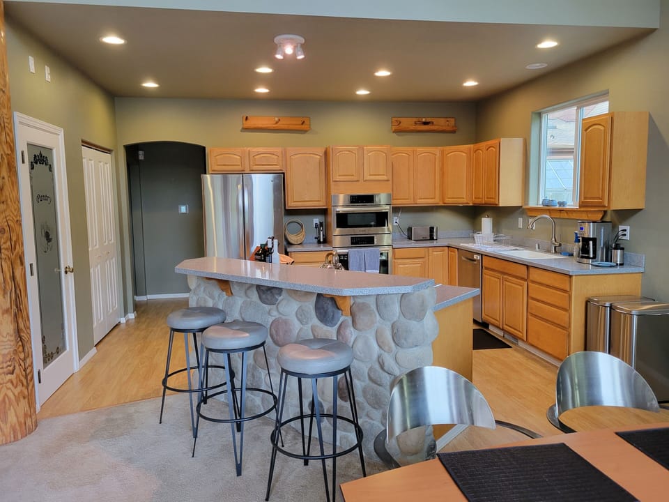 Kitchen bar so friends and family can join while someone is cooking