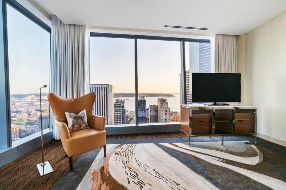 Watch the sunset over the skyline from a cozy corner seat.