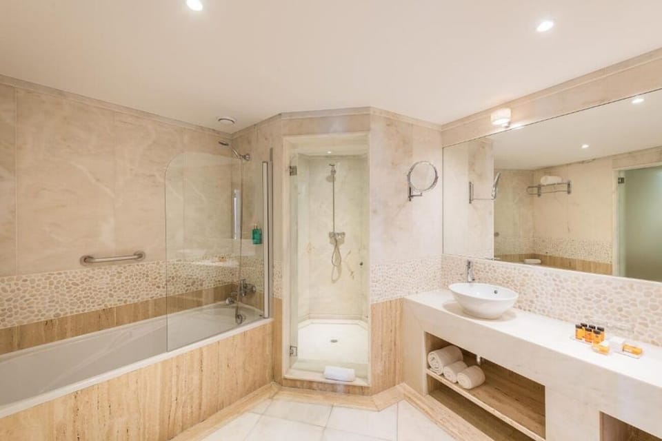Refresh in a spa-like bath with tub and rainfall shower.