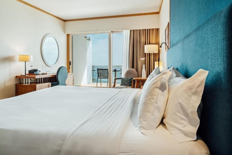 Lounge in crisp linens with the horizon as backdrop.