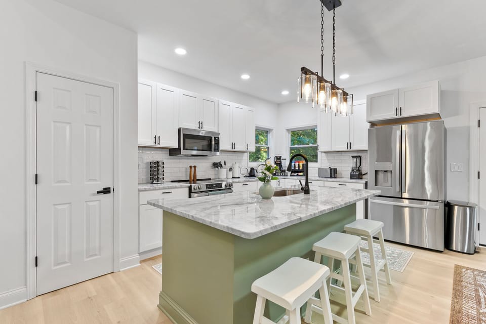 Fully renovated kitchen with gorgeous countertops and stainless steel appliances