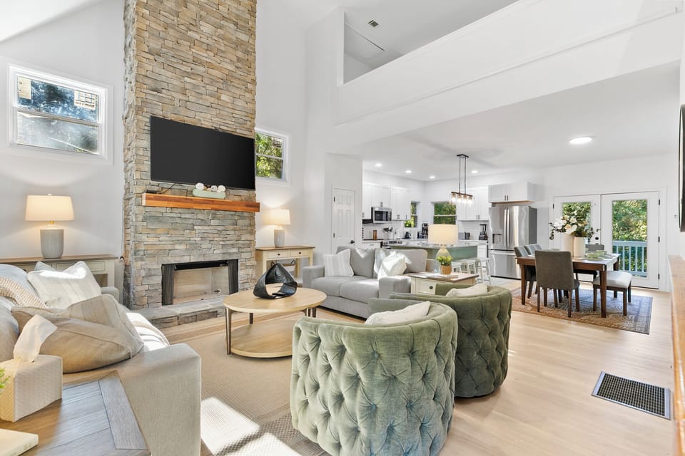 Bright, modern living space with smart TV and plenty of comfortable seating