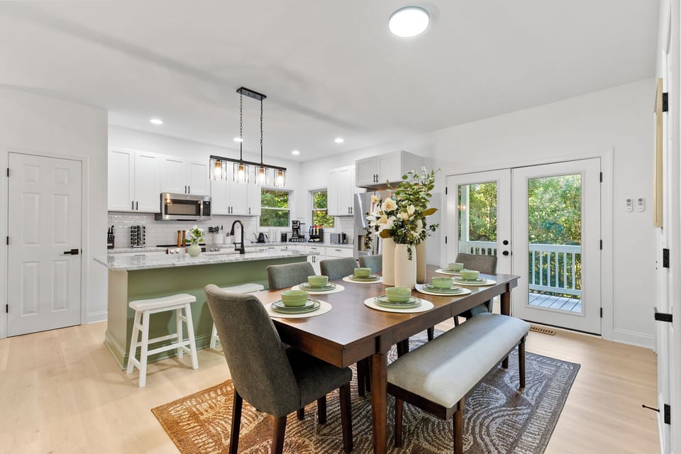 Open floor plan connects kitchen, dining, and living spaces